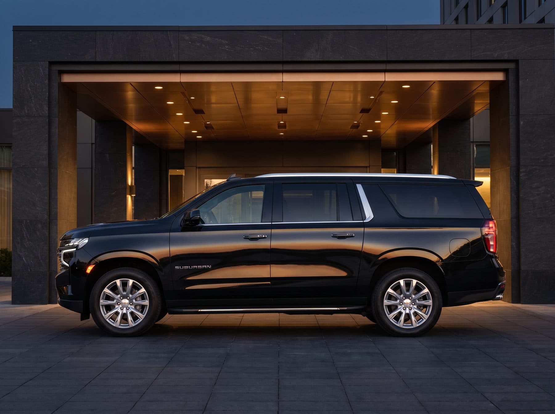 Chevrolet Suburban executive SUV, black, side profile